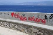 Hydra Islan d - Seawall with Refugees Welcome Sign