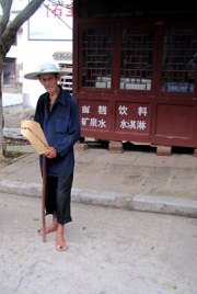 Old Man in the Street with Broom