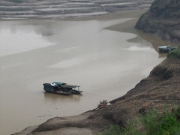 Three Sampans Near Shore